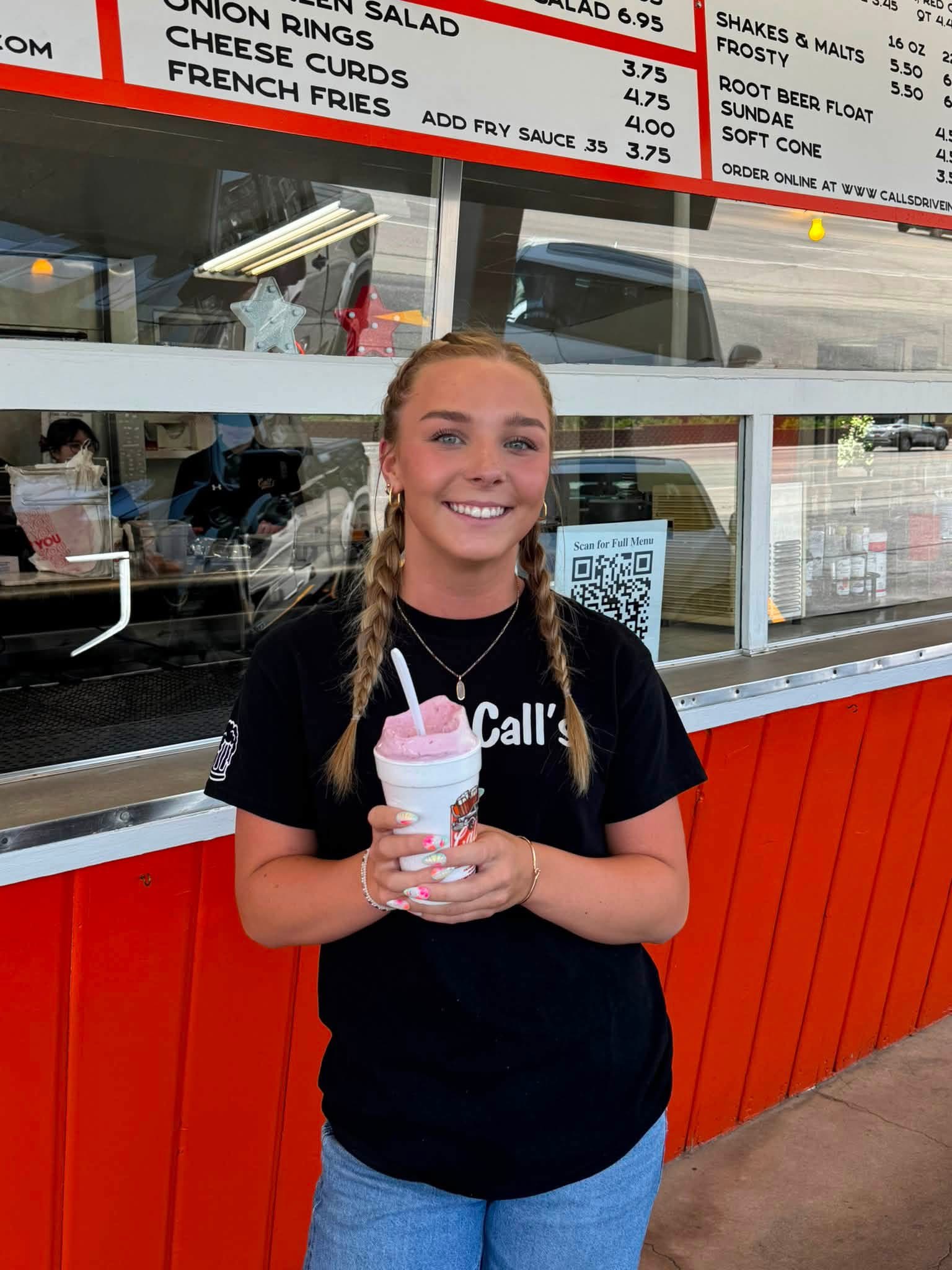 Call's team member holding a Fresh Raspberry Shake made with premium soft serve